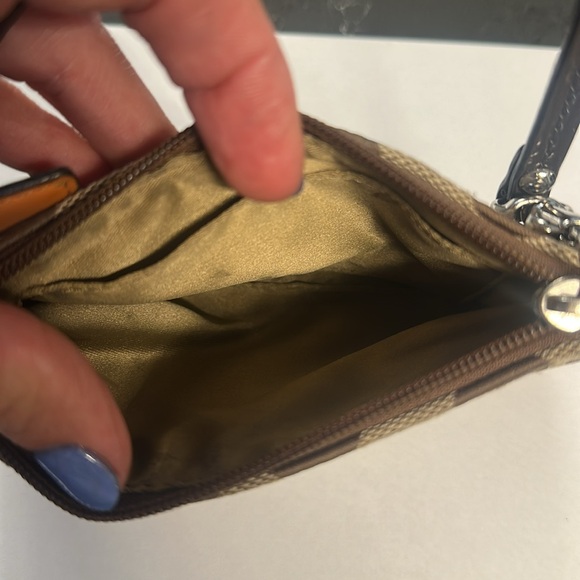 COACH wristlet 6x4 inches in size.  Inside is in great condition.  Tan/brown - Picture 3 of 3